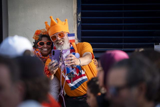 Partygoers take a selfie in Utrecht on April 26, 2026, on the eve of the traditional Kingsday, a national holiday that marks the birthday of King Willem-Alexander of Netherlands. (Photo by Jeroen Jumelet / ANP / AFP) / Netherlands OUT