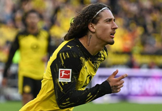 Dortmund's Portuguese forward #21 Fabio Silva celebrates scoring the 4-0 goal with his teammates during the German first division Bundesliga football match between BVB Borussia Dortmund and SC Freiburg in Dortmund, western Germany on April 26, 2026. (Photo by INA FASSBENDER / AFP) / DFL REGULATIONS PROHIBIT ANY USE OF PHOTOGRAPHS AS IMAGE SEQUENCES AND/OR QUASI-VIDEO  ALTERNATIVE CROP
