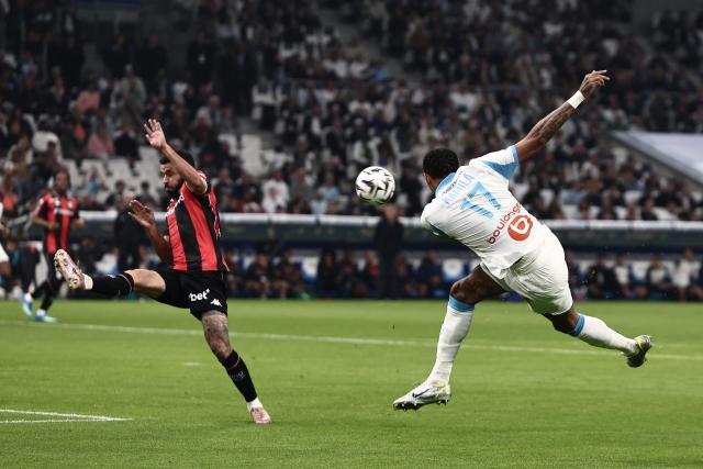 Marseille's Gabonese forward #17 Pierre-Emerick Aubameyang (R) shoots towards goal during the French Ligue 1 football match between Olympique de Marseille (OM) and OGC Nice at the Velodrome stadium in Marseille, south-eastern France on April 26, 2026. (Photo by Thibaud MORITZ / AFP)