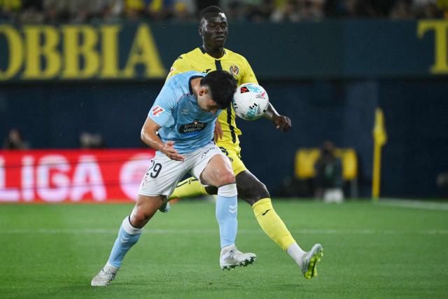 Celta Vigo's Spanish midfielder #29 Yoel Lago and Villarreal's Senegalese midfielder #18 Pape Gueye fight for the ball during the Spanish league football match between Villarreal CF and RC Celta de Vigo at La Ceramica Stadium in Vila-real on April 26, 2026. (Photo by JOSE JORDAN / AFP)