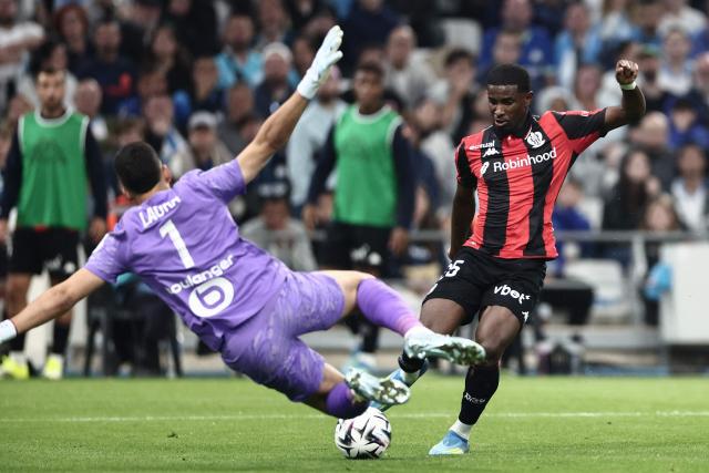 Nice's French forward #25 Mohamed-Ali Cho (R) shoots towards goal during the French Ligue 1 football match between Olympique de Marseille (OM) and OGC Nice at the Velodrome stadium in Marseille, south-eastern France on April 26, 2026. (Photo by Thibaud MORITZ / AFP)