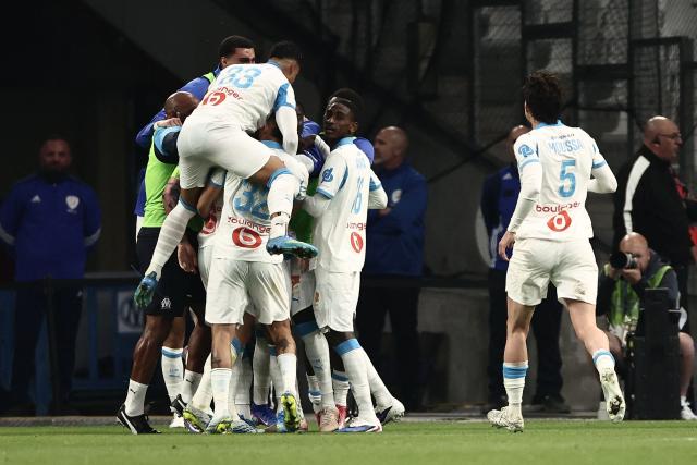 Marseille's players celebrate scoring their first goal during the French Ligue 1 football match between Olympique de Marseille (OM) and OGC Nice at the Velodrome stadium in Marseille, south-eastern France on April 26, 2026. (Photo by Thibaud MORITZ / AFP)