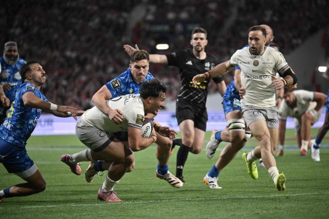 Toulouse's French centre Kalvin Gourgues is tackled during the French Top 14 rugby union match between Stade Toulousain and ASM Clermont Auvergne at the Ernest Wallon Stadium in Toulouse, southwestern France, on April 26, 2026. (Photo by Ed JONES / AFP)