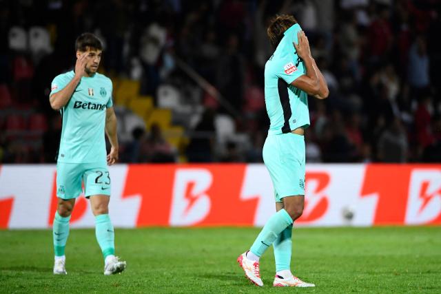 Sporting Lisbon's Japanese midfielder #05 Hidemasa Morita (R) reacts at the end of the Portuguese League football match between AVS Futebol SAD and Sporting CP at CD Aves stadium in Vila das Aves on April 26, 2026. (Photo by MIGUEL LEMOS / AFP)