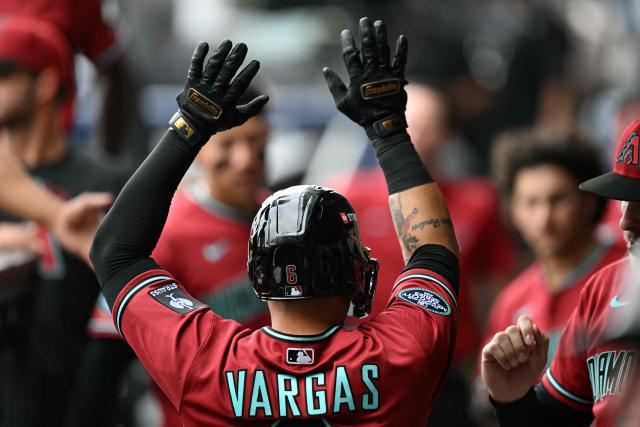 Arizona Diamondbacks' #06 Ildemaro Vargas celebrates with teammates after hitting a home run during the MLB World Tour Mexico City Series game between the Arizona Diamondbacks and the San Diego Padres at Alfredo Harp Helu Stadium in Mexico City on April 26, 2026. (Photo by YURI CORTEZ / AFP)