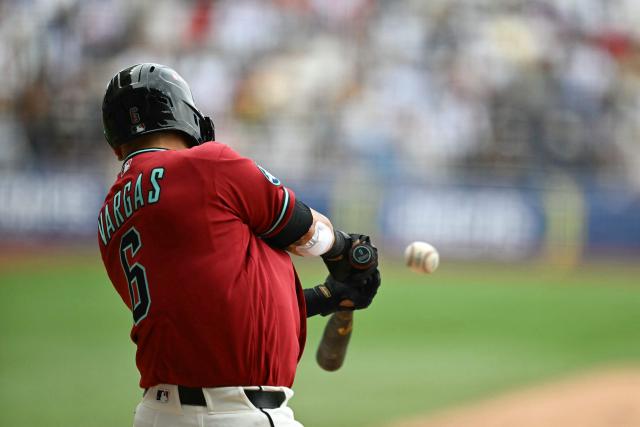 Arizona Diamondbacks' #06 Ildemaro Vargas hits a home run during the MLB World Tour Mexico City Series game between the Arizona Diamondbacks and the San Diego Padres at Alfredo Harp Helu Stadium in Mexico City on April 26, 2026. (Photo by YURI CORTEZ / AFP)