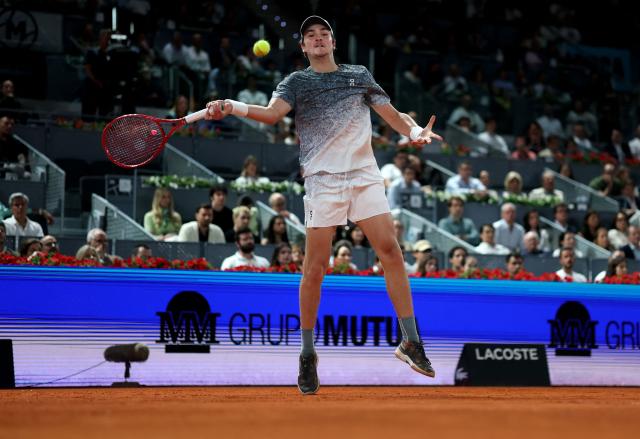 Brazil's Joao Fonseca returns the ball to Spain's Rafael Jodar during their 2026 ATP Tour Madrid Open tennis tournament third round singles match at the Caja Magica in Madrid, on April 26, 2026. (Photo by Thomas COEX / AFP)