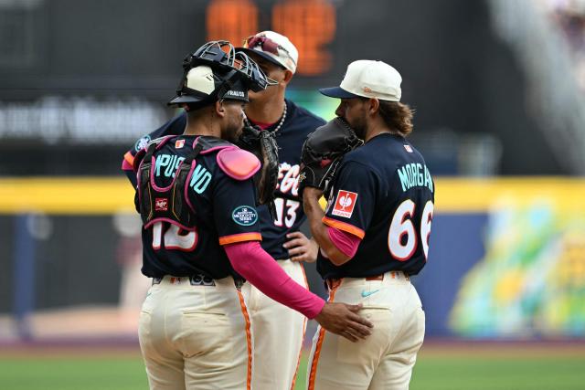 San Diego Padres' #12 Luis Campusano (L), #66 David Morgan (R) and #13 Manny Machado confer on the mound during the MLB World Tour Mexico City Series game between the Arizona Diamondbacks and the San Diego Padres at Alfredo Harp Helu Stadium in Mexico City on April 26, 2026. (Photo by YURI CORTEZ / AFP)
