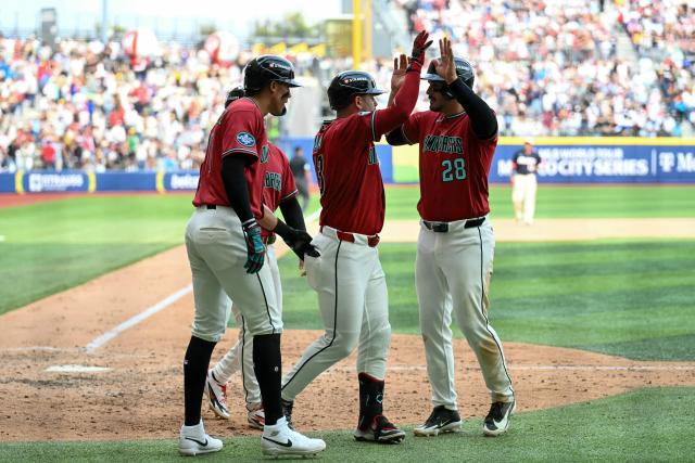 Arizona Diamondbacks players celebrate after hitting a three-run home run during the MLB World Tour Mexico City Series game between the Arizona Diamondbacks and the San Diego Padres at Alfredo Harp Helu Stadium in Mexico City on April 26, 2026. (Photo by YURI CORTEZ / AFP)