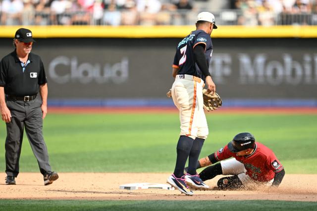 Arizona Diamondbacks' #06 Ildemaro Vargas slides into second base past San Diego Padres' #02 Xander Bogaerts during the MLB World Tour Mexico City Series game between the Arizona Diamondbacks and the San Diego Padres at Alfredo Harp Helu Stadium in Mexico City on April 26, 2026. (Photo by YURI CORTEZ / AFP)