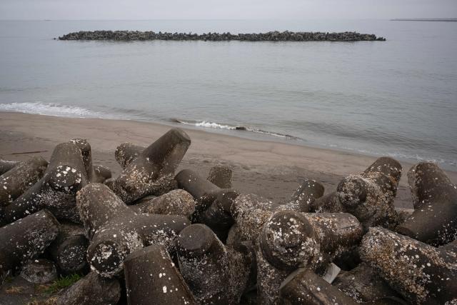 Tsunami barriers are seen on the beach in Ishinomaki, Miyagi Prefecture on April 27, 2026. A strong earthquake rattled Japan's northern island of Hokkaido early on April 27, US and Japanese meteorological agencies reported, the latest in a series of powerful tremors to hit the island nation. (Photo by ANDREW CABALLERO-REYNOLDS / AFP)