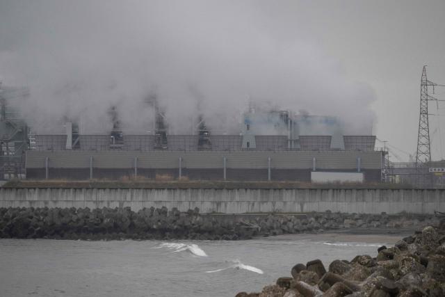 Steam rises out of a power station protected by a tsunami sea wall in Ishinomaki, Miyagi Prefecture on April 27, 2026. A strong earthquake rattled Japan's northern island of Hokkaido early on April 27, US and Japanese meteorological agencies reported, the latest in a series of powerful tremors to hit the island nation. (Photo by ANDREW CABALLERO-REYNOLDS / AFP)