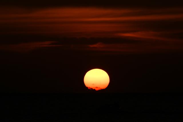 The sun sets over Pozos Colorados Beach in Santa Marta, Colombia, on April 26, 2026, during the International Conference on the Just Transition Away from Fossil Fuels. (Photo by Raul ARBOLEDA / AFP)