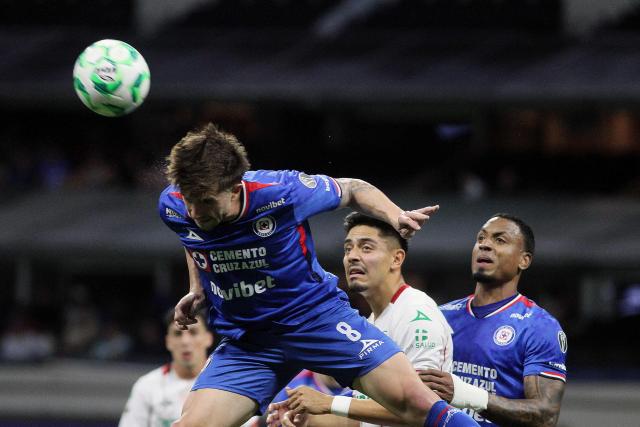 Cruz Azul's Argentine midfielder #08 Agustin Palavecino heads the ball during the Liga MX Clausura football match between Cruz Azul and Necaxa at Banorte Stadium in Mexico City on April 26, 2026. (Photo by Victor Cruz / AFP)