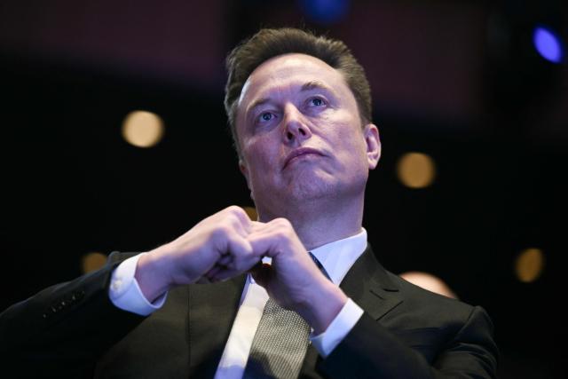 (FILES) Elon Musk looks on as US President Donald Trump speaks at the US-Saudi Investment Forum at the John F. Kennedy Center for the Performing Arts in Washington, DC on November 19, 2025. Elon Musk's lawsuit accusing high-profile artificial intelligence company OpenAI of betraying its non-profit mission heads for trial on April 27, 2026 with the selection of jurors. The legal clash in a courtroom across the bay from San Francisco pits the world's richest person against a startup Musk once backed and now competes with in the booming AI sector. (Photo by Brendan SMIALOWSKI / AFP)