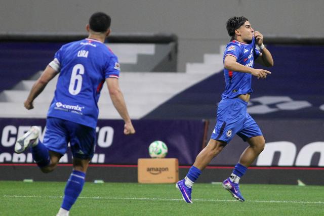 Cruz Azul's forward #18 Luka Romero (R) celebrates scoring his team's third goal during the Liga MX Clausura football match between Cruz Azul and Necaxa at Banorte Stadium in Mexico City on April 26, 2026. (Photo by Victor Cruz / AFP)