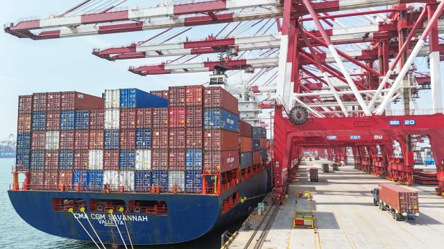 This picture taken on April 26, 2026 shows a cargo ship berthed at the Qianwan Container Terminal of Qingdao port, in China’s eastern Shandong province. (Photo by CN-STR / AFP) / China OUT