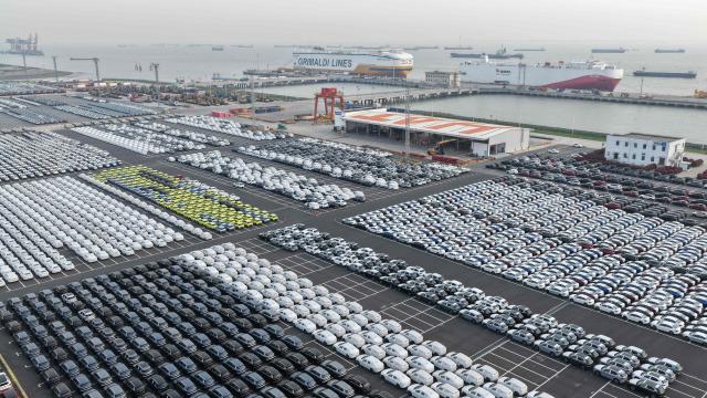 Chinese-made vehicles including BYD cars (bottom L) wait to be transshipped for export at a port in Suzhou, in China’s eastern Jiangsu province on April 27, 2026. (Photo by CN-STR / AFP) / China OUT