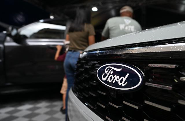 A logo of the US Ford Motor Company on a pick-up truck is pictured during the 14th edition of Venezuela’s largest automotive exhibition, "AutoFest 2026," at the Centro Comercial Ciudad Tamanaco (CCCT) in Caracas on April 26, 2026. (Photo by Juan BARRETO / AFP)