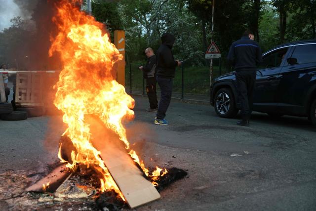 Striking prison staff block access to the Bois-d'Arcy detention center, west of Paris, on April 27, 2026, after the Ufap-Unsa union called for a blockade of prisons to draw attention to prison overcrowding and “fill the 5,000 vacant positions.” (Photo by Alain JOCARD / AFP)