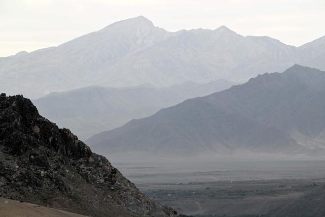 A general view shows mountains at the Sayad area of Reg-e-Rawan in Kapisa province on April 24, 2026. Hundreds of visitors travel each weekend to Reg-e-Rawan -- "the moving sands" in Dari -- to practice parkour or roll down the honey-coloured sand in Kapisa province and to unwind beside breathtaking views. (Photo by Wakil KOHSAR / AFP)