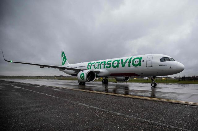 (FILES) This photograph taken on December 19, 2023, shows a view of an Airbus 321neo aircraft from Transavia arriving at Schiphol Airport. Transavia, the low-cost carrier of the Air France-KLM group, will adjust its scheduled flight program for May and June 2026 to optimize its costs in response to the surge in kerosene prices linked to the war in the Middle East, a spokesperson told AFP on April 26, 2026, confirming a report by RMC. (Photo by Eva Plevier / ANP / AFP) / Netherlands OUT