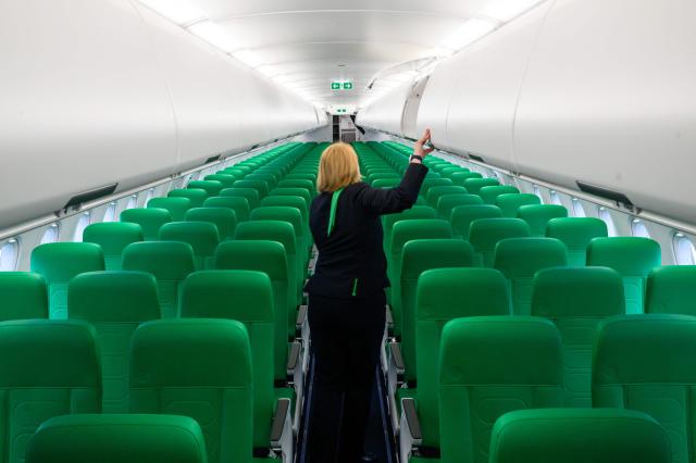(FILES) An employee walks between seats aboard an Airbus A320neo aircraft during a delivery event to low-cost carrier Transavia, in Toulouse, southwestern France, on January 10, 2024. Transavia, the low-cost carrier of the Air France-KLM group, will adjust its scheduled flight program for May and June 2026 to optimize its costs in response to the surge in kerosene prices linked to the war in the Middle East, a spokesperson told AFP on April 26, 2026, confirming a report by RMC. (Photo by Ed JONES / AFP)