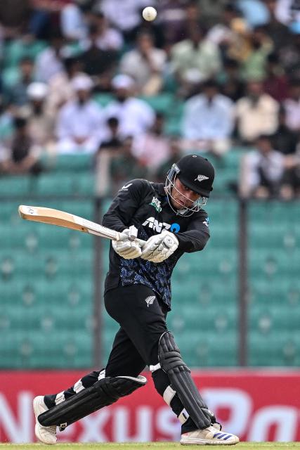 New Zealand's Katene Clarke plays a shot during the first T20 cricket match between Bangladesh and New Zealand at the Bir Sreshtho Flight Lieutenant Matiur Rahman Stadium in Chittagong on April 27, 2026. (Photo by Munir UZ ZAMAN / AFP)
