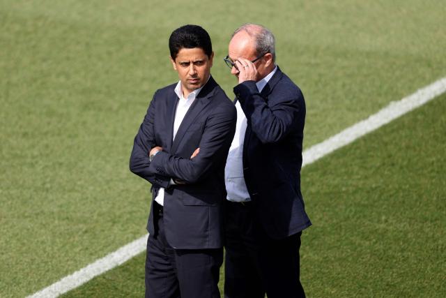 Paris Saint Germain's Qatari president Nasser al-Khelaifi (L) looks on during a training session of French football club Paris Saint-Germain a day ahead of their UEFA Champions League semi-final match against German club FC Bayern Munich at the PSG Campus in Poissy, north-west of Paris, on April 27, 2026. (Photo by FRANCK FIFE / AFP)