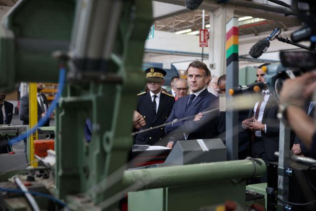 France's President Emmanuel Macron visits the future site of the Occitanie Géotex plant, which will manufacture geotextiles for construction, roads, and agriculture using plant-based hemp fibers and wool produced in the region, in Laroque-d'Olmes, south-western France, on April 27, 2026. Emmanuel Macron will travel to south western France's Ariège department on April 27, 2026, a trip focused on reindustrialization and health, before a two-day visit to the microstate of Andorra of which his is also Co-Prince, where the sensitive issue of abortion will be discussed. (Photo by Valentine CHAPUIS / POOL / AFP)