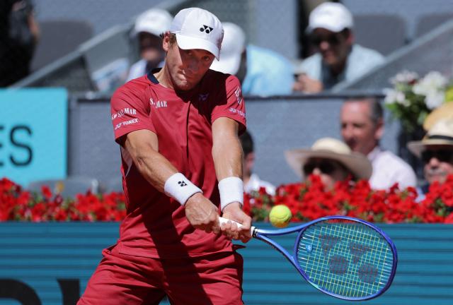 Norway’s Casper Ruud returns the ball to Spain’s Alejandro Davidovich Fokina during their 2026 ATP Tour Madrid Open tennis tournament third round singles match at the Caja Magica in Madrid, on April 27, 2026. (Photo by Thomas COEX / AFP)