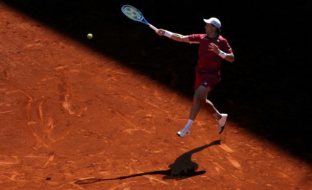 Norway’s Casper Ruud returns the ball to Spain’s Alejandro Davidovich Fokina during their 2026 ATP Tour Madrid Open tennis tournament third round singles match at the Caja Magica in Madrid, on April 27, 2026. (Photo by Thomas COEX / AFP)