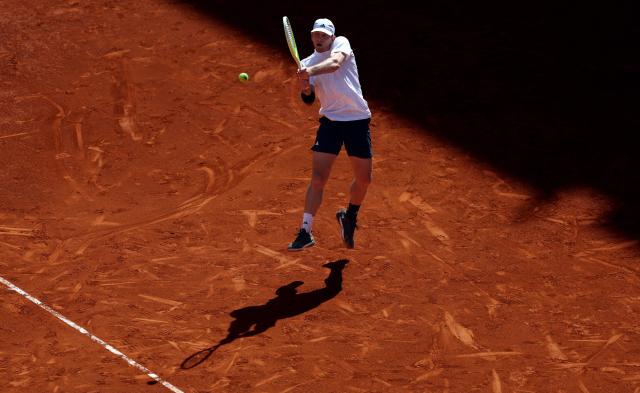 Spain’s Alejandro Davidovich Fokina returns the ball to Norway’s Casper Ruud during their 2026 ATP Tour Madrid Open tennis tournament third round singles match at the Caja Magica in Madrid, on April 27, 2026. (Photo by Thomas COEX / AFP)