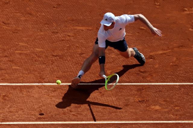 Spain’s Alejandro Davidovich Fokina returns the ball to Norway’s Casper Ruud during their 2026 ATP Tour Madrid Open tennis tournament third round singles match at the Caja Magica in Madrid, on April 27, 2026. (Photo by Thomas COEX / AFP)