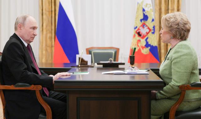 In this pool photograph distributed by the Russian state agency Sputnik, Russia's President Vladimir Putin meets with Federation Council speaker Valentina Matviyenko in Saint Petersburg on April 27, 2026. (Photo by Gavriil Grigorov / POOL / AFP)