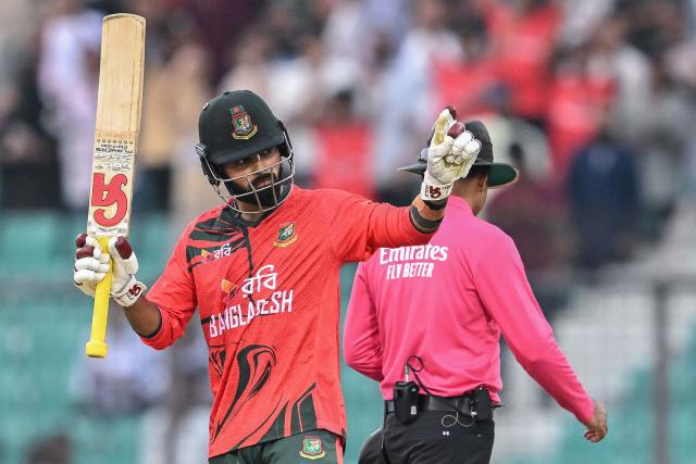 Bangladesh's Tawhid Hridoy (L) reacts after scoring a half-century (50 runs) during the first T20 international cricket match between Bangladesh and New Zealand at the Bir Sreshtho Flight Lieutenant Matiur Rahman Stadium in Chittagong on April 27, 2026. (Photo by Munir UZ ZAMAN / AFP)