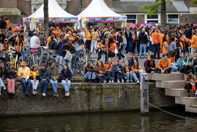 Revelers take part in King's Day celebrations in the Dutch capital Amsterdam on April 27, 2026. King's day is a national holiday in the Kingdom of the Netherlands and is celebrated on April 27, marking the birth of the Dutch King. (Photo by Michel van Bergen / ANP / AFP) / Netherlands OUT