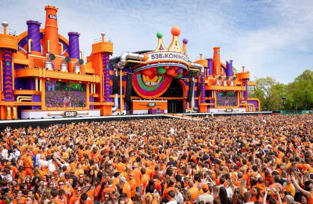 Festival-goers dressed in orange attend the Radio 538 King's Day celebration in Breda on April 27, 2026. (Photo by Iris van den Broek / ANP / AFP) / Netherlands OUT