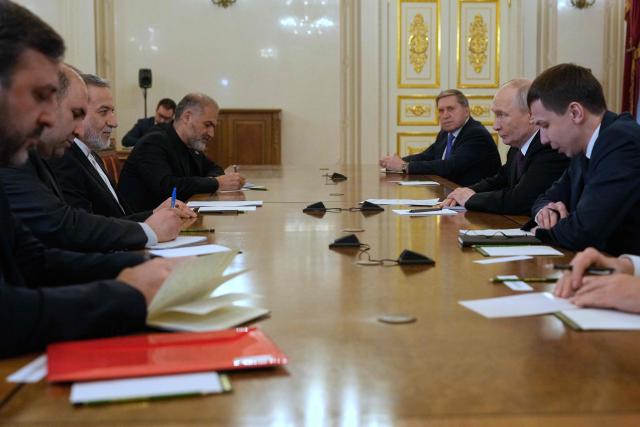 Russian President Vladimir Putin and Iranian Foreign Minister Abbas Araghchi hold talks at the Boris Yeltsin Presidential Library in Saint Petersburg on April 27, 2026. (Photo by Dmitry LOVETSKY / POOL / AFP)