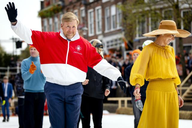 King Willem-Alexander of the Netherlands (L) and Queen Maxima of the Netherlands (R) ice skate during the King's Day celebrations, in Dokkum on April 27, 2026. King's day is a national holiday in the Kingdom of the Netherlands. Celebrated on 27 April the date marks the birth of King Willem-Alexander. (Photo by Sem van der Wal / various sources / AFP) / Netherlands OUT