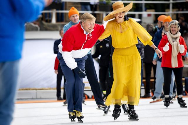 King Willem-Alexander of the Netherlands (L) and Queen Maxima of the Netherlands (R) ice skate during the King's Day celebrations, in Dokkum on April 27, 2026. King's day is a national holiday in the Kingdom of the Netherlands. Celebrated on 27 April the date marks the birth of King Willem-Alexander. (Photo by Sem van der Wal / various sources / AFP) / Netherlands OUT