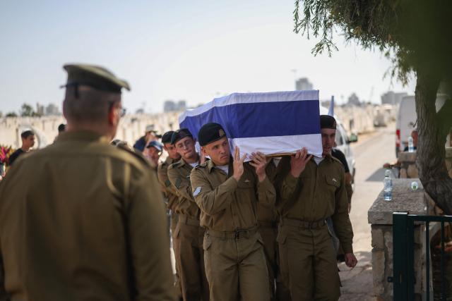 Soldiers carry the casket of Sergeant Idan Fooks, who was killed in combat in southern Lebanon, during the funeral in Petah Tikva on April 27, 2026. The Israeli military said on April 26 that a soldier was killed in southern Lebanon, where a ceasefire has been in place since mid-April. Sergeant Idan Fooks, 19, died "during combat" in south Lebanon, while "an officer and three additional soldiers were severely injured, along with a soldier who was moderately injured and a soldier who was lightly injured", the military said. (Photo by Ilia YEFIMOVICH / AFP) / 