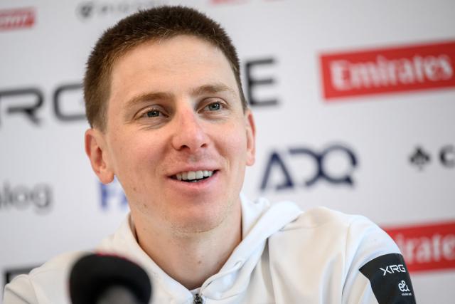 UAE Team Emirates-XRG's Slovenian rider Tadej Pogacar speaks during a press conference ahead of the Tour of Romandy cycling stage race, in Vevey, Switzerland on April 27, 2026. (Photo by Fabrice COFFRINI / AFP)