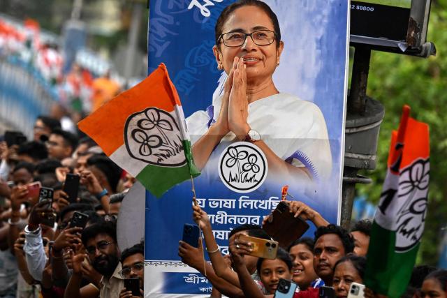 Supporters of the All India Trinamool Congress party attend a rally of Chief Minister of West Bengal Mamata Banerjee ahead of the second phase of the legislative assembly elections in Kolkata on April 27, 2026. (Photo by Dibyangshu SARKAR / AFP)