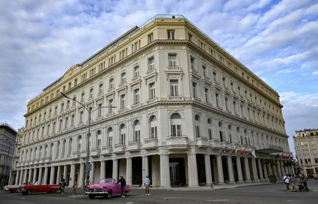 (FILES) View of the Gran Hotel Manzana Kempinski in Havana on March 12, 2026. Tourist arrivals in Cuba plummeted in the first quarter of 2026, affected by the US fuel embargo and the suspension of international flights. Between January and March, the island received 298,057 foreign visitors, 48% fewer than in the same period in 2025, according to figures published by the National Office for Statistics and Information. (Photo by YAMIL LAGE / AFP)