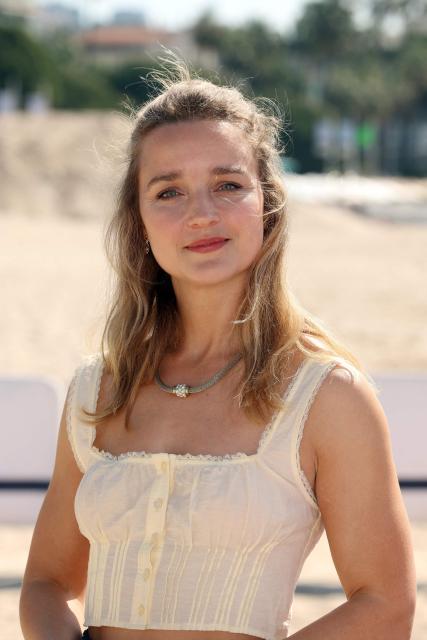British actress Florence Hall poses during the "This is not a murder mystery" photocall as part of the 9th edition of the Canneseries international series festival in Cannes, southern France, on April 27, 2026. (Photo by Valery HACHE / AFP)