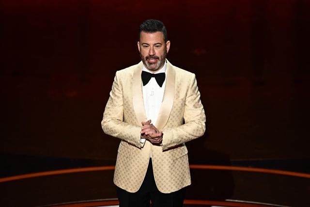 (FILES) TV host Jimmy Kimmel speaks onstage during the 96th Annual Academy Awards at the Dolby Theatre in Hollywood, California on March 10, 2024. Donald Trump called for US comedian Jimmy Kimmel to be sacked for likening First Lady Melania Trump to an "expectant widow," in a joke made days before a shooting at a dinner attended by the president. "Jimmy Kimmel should be immediately fired by Disney and ABC" over the "despicable call to violence", Trump said on April 27, 2026 in a post on Truth Social, hours after Melania Trump also criticized the comment. (Photo by Patrick T. Fallon / AFP)