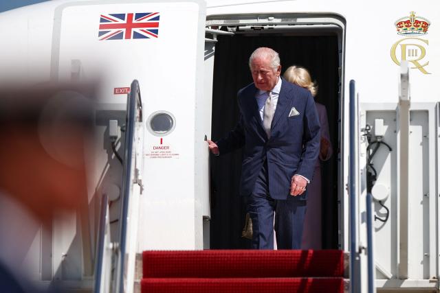 Britain's King Charles III and Queen Camilla arrive at Joint Base Andrews, Maryland, on April 27, 2026. King Charles III arrives in Washington Monday for a high-stakes state visit aimed at salvaging Britain's frayed ties with Donald Trump, amid extra-tight security following an attack on a gala dinner attended by the US president. Tensions over the Iran war have rocked the so-called "special relationship" ahead of a trip that was meant to mark the United States' 250th anniversary of independence from the British monarch's ancestors. (Photo by HENRY NICHOLLS / POOL / AFP)