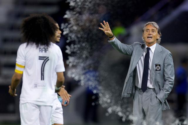 Sadd's Italian coach Roberto Mancini instructs his players during the Qatar Stars League match between Al-Sadd and Al-Shamal at Jassim Bin Hamad Stadium in Doha on April 27, 2026. (Photo by Karim JAAFAR / AFP)