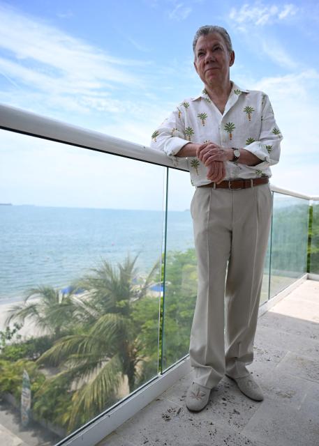 Colombia's former president (2010-2018) Juan Manuel Santos poses during an interview with AFP in the sidelines of the First Conference Transitioning away from Fossil Fuels at Port Beach in Santa Marta, on April 27, 2026. (Photo by Raul ARBOLEDA / AFP)